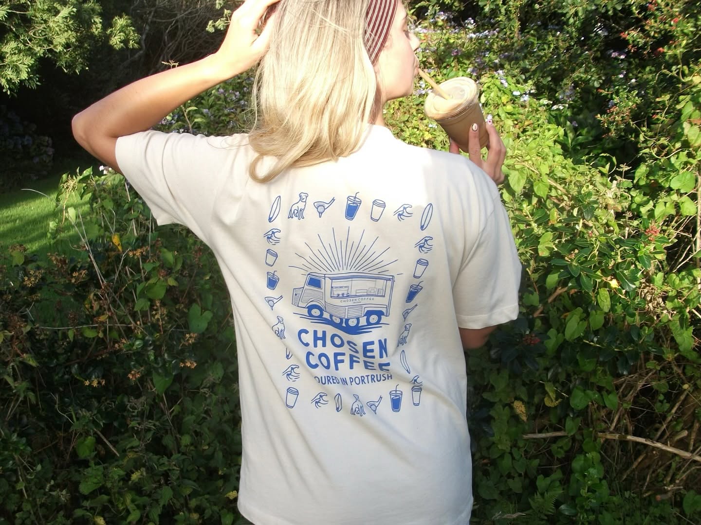 Cream Chosen Coffee t-shirt worn outdoors, illustrated back print
